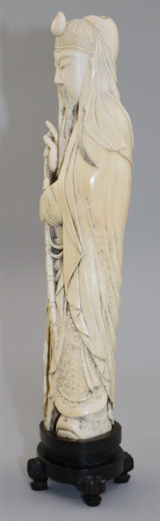 A Chinese ivory tusk figure of Lu Dongbin, late 19th / early 20th century, total height 30.5cm